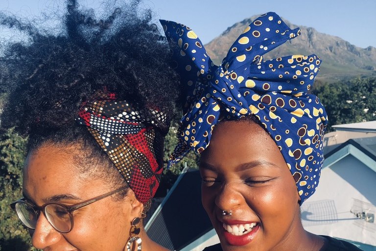 Two women wearing FLOWW headwraps, Stellenbosch
