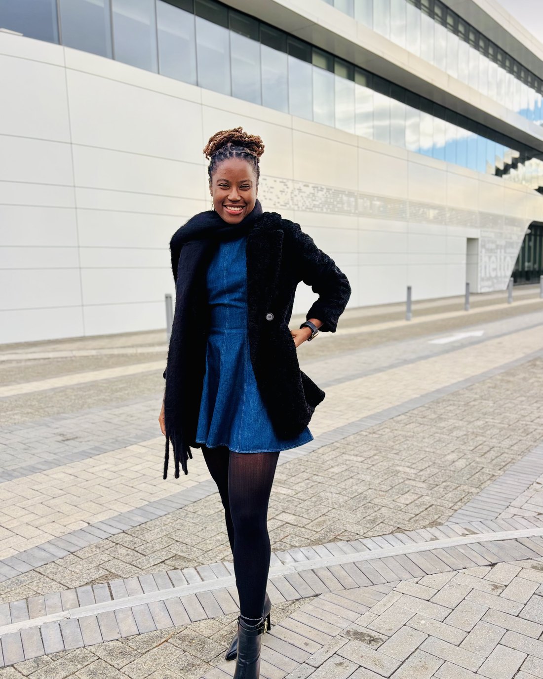 Deborah Kapenda outside an office building